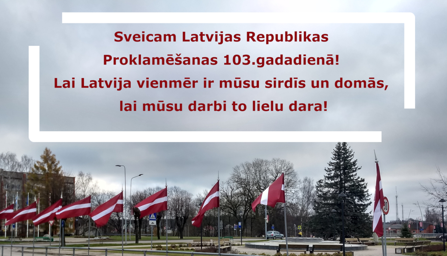 Attēls ar Latvijas karogiem un apsveikumu 18.novembrī