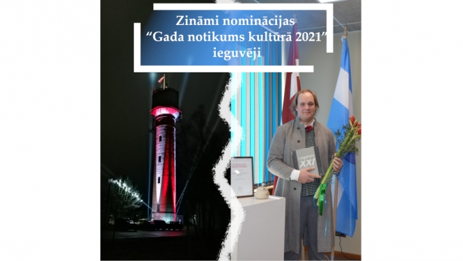 Attēls ar izgaismotu ūdenstorni un cilvēku pie karoga