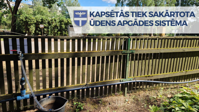 koka žodziņš pie kura piestiprināts ūdens vads un krāns