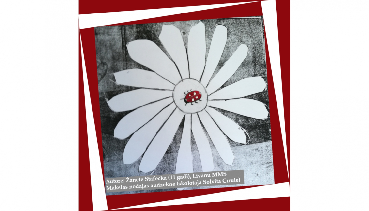 Bērna veidots mākslas darbs ar sarkanbaltu mārīti vidū